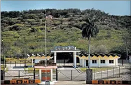  ?? RAMON ESPINOSA/AP ?? The White House has endorsed a proposal for a new super-max unit at the Guantanamo Bay U.S. Naval Base. Above, the boundary between the Cuban and U.S. sides is visible.