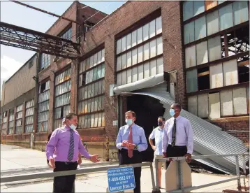  ?? Christian Abraham / Hearst Connecticu­t Media ?? U.S. Sen. Richard Blumenthal, D-Conn., center, tours the former Ansonia Copper and Brass factory in Ansonia on Tuesday. At left is Ansonia Mayor David Cassetti and, at right, is state Sen. George Lucas.