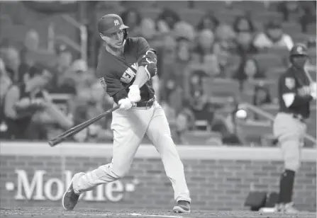  ?? ASSOCIATED PRESS FILE PHOTO ?? Yankees right-fielder Giancarlo Stanton hits a two-run home run in a spring training baseball game against the Braves on Monday in Atlanta.