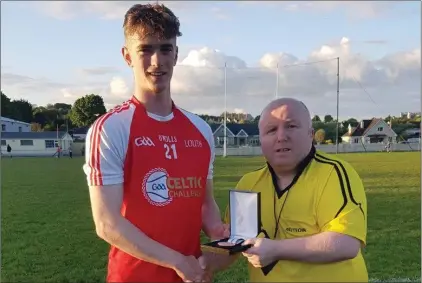  ??  ?? Louth’s Paul McEvoy receives the Best and Fairest award.