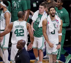  ?? The Associated Press John Minchillo ?? Celtics forward Jayson Tatum, right, celebrates Boston’s four-game sweep of the Nets on Monday in the first round of the playoffs.