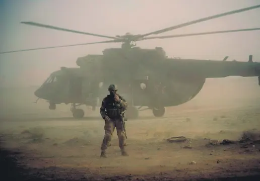  ?? ?? A helicopter is seen amid a dust storm at an airport in Deir eI-Zour, Syria, Sept. 15, 2017.