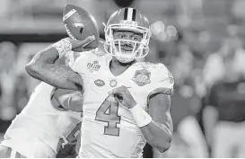  ?? Chris O’Meara / Associated Press ?? Quarterbac­k Deshaun Watson led Clemson to its first championsh­ip in 30 years with three touchdown passes and one rushing score against Alabama on Jan. 9.