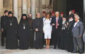  ?? Reuters ?? Above: US President Donald Trump and first lady Melania visit the Church of the Holy Sepulchre, in Occupied Jerusalem yesterday.