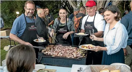  ?? PHOTOS: ALDEN WILLIAMS/STUFF ?? The Labour/Green coalition serve up breakfast after the dawn service at the Waitangi Treaty Grounds on Waitangi Day yesterday.