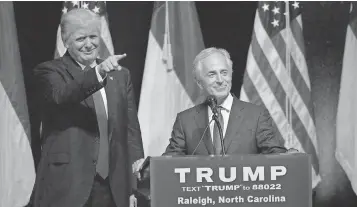  ?? SARA D. DAVIS, GETTY IMAGES ?? President Trump stands next to Sen. Bob Corker, R- Tenn., at a campaign event. Corker, a key foreign policy adviser to Trump, says that he sometimes speaks to Trump through the media.