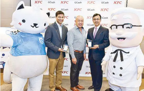  ??  ?? Ernest Cu, Globe president and CEO is flanked by Anthony Thomas, Mynt president and CEO, and KFC CEO Ajay Pahwa