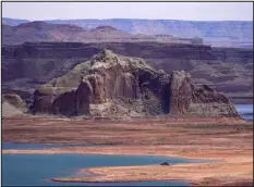  ?? ROSS D. FRANKLIN — ASSOCIATED PRESS FILE ?? Water levels are low in June 2021 at Lake Powell’s Wahweap Bay at the Utah-arizona state line at Wahweap, Ariz.