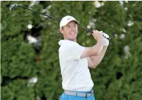  ?? AFP ?? Rory McIlroy is three strokes adrift of leader Brian Harman. —