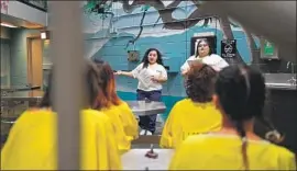  ??  ?? KARLA ESPINOZA, left, and Josefina Ramirez speak to fellow inmates in October. Of the 16,600 inmates in the L.A. County jail system, about 2,100 are women.