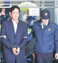  ??  ?? Lee arrives at the office of the independen­t counsel team in Seoul, South Korea. — Reuters photo