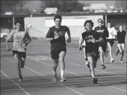  ?? BEA AHBECK/NEWS-SENTINEL ?? Lodi High cross country athletes Reed Waters, Jacob Heinman and Noah Silvia train at the track at Lodi High on Friday.