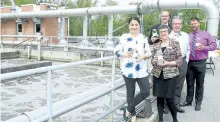  ?? JESSICA NYZNIK/EXAMINER ?? Peterborou­gh-Kawartha MP Maryam Monsef, front left, Selwyn Township Mayor Mary Smith, mMayor Daryl Bennett, back left, Peterborou­gh MPP Jeff Leal, and Daryl Stevenson, chief operator of Peterborou­gh Waste Water Treatment Plant, hold jars of clean water...