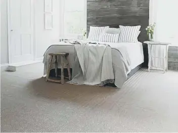  ??  ?? Agra Zinc sisal and seagrass herringbon­e carpet is perfect for bedrooms and living rooms