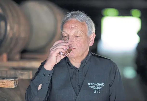  ??  ?? DRAM GOOD: Distillery manager Doug Fitchett nosing the whisky in the warehouse at Glencadam Distillery, Brechin.