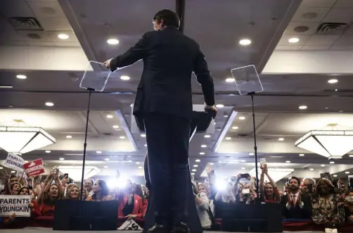  ?? Anna Moneymaker, Getty Images ?? With “Parents for Youngkin” placards seen in the crowd, Virginia Republican gubernator­ial candidate Glenn Youngkin speaks during an election-night rally Tuesday in Chantilly, Va.