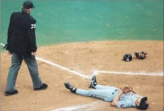  ?? Don Tormey
Los Angeles Times ?? ANGELS PITCHER Mark Langston is flat on his back after the Seattle Mariners took a big lead in a one-game playoff for the AL West title in 1995. Seattle won, 9-1, behind a dominant Randy Johnson.