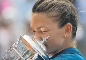  ?? Picture / AP ?? Simona Halep celebrates winning the French Open against American Sloane Stephens yesterday.