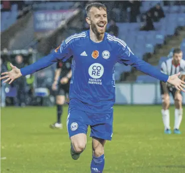  ?? ?? ALL SMILES: Elliot Newby after scoring in Town’s 7-4 FA Cup first round win over Maidenhead United at The Shay last Saturday. Photo: Marcus Branston.