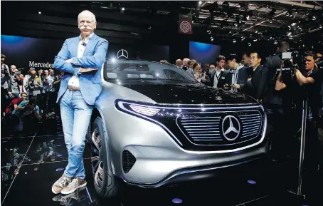  ?? PHOTOS: MICHEL EULER/THE ASSOCIATED PRESS ?? Dieter Zetsche, CEO of the Daimler AG, with the Mercedes EQ concept car at the Paris auto show in France, Thursday. Many major automakers find the show, held in a city whose mayor wants to ban diesels, a fine place to show off new electric cars.