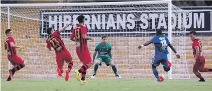  ??  ?? Alex da Paixao Alves (no.18) shooting at goal in front of David Cassar Photo: Michael Camilleri