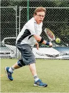  ??  ?? Backhand slice Colin Magee in action during the men’s doubles final