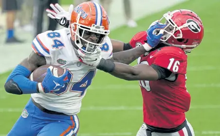  ?? John Raoux, The Associated Press ?? Florida’s Kyle Pitts, left, is considered the top tight end prospect in the NFL Draft this year. “I think you can make a strong case he’s the best player in the draft,” NFL Network analyst Daniel Jeremiah said.