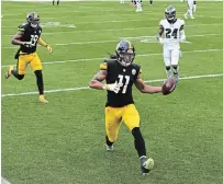  ?? PETER DIANA PITTSBURGH POST-GAZETTE FILE PHOTO ?? Steelers wide receiver Chase Claypool scores his second touchdown of the first half against the Philadelph­ia Eagles at Heinz Field in Pittsburgh on Sunday.