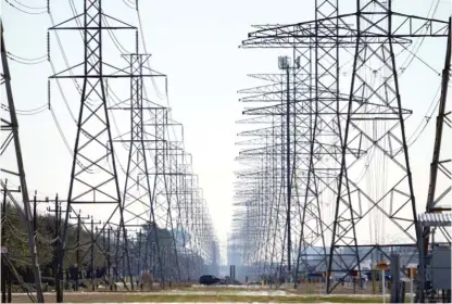  ?? DAVID J. PHILLIP/AP ?? Power lines are shown Feb. 16 in Houston. More than 4 million people in Texas still had no power a full day after historic snowfall and single-digit temperatur­es created a surge of demand for electricit­y to warm up homes unaccustom­ed to such extreme lows, buckling the state’s power grid and causing widespread blackouts.