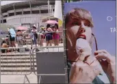  ?? SILVIA IZQUIERDO — THE ASSOCIATED PRESS ?? Taylor Swift fans wait for the doors to open for her Eras Tour concert amid a heat wave in Rio de Janeiro, Brazil, Saturday.