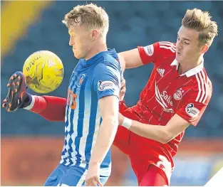  ??  ?? Killie’s Luke Hendrie clashes with Aberdeen’s James Maddison.