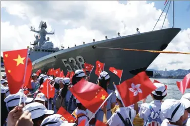  ?? ROY LIU / CHINA DAILY ?? Residents see off the guided-missile frigate CNS Yantai during the farewell ceremony for the naval flotilla, led by aircraft carrier Liaoning, at Ngong Shuen Chau Naval Base on Stonecutte­rs Island on Tuesday.