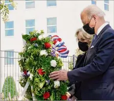  ?? Alex Brandon / Associated Press ?? President Joe Biden and first lady Jill Biden participat­e in a wreath ceremony Saturday on the 20th anniversar­y of the terrorist attacks at the Pentagon at the National 9/11 Pentagon Memorial site in Washington.