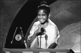  ?? STUART RAMSON / ASSOCIATED PRESS FILE (1999) ?? Hydeia Broadbent, 14, speaks after receiving an Essence Award during a taping of the awards show April 30, 1999, in New York. Broadbent, who was born with HIV and had been living with full-blown AIDS since age 5, became a powerful spokespers­on and AIDS activist. She died Tuesday in Las Vegas. She was 39.