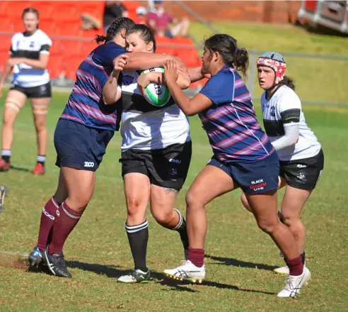  ?? Photo: Gerard Walsh ?? GRAND FINAL CLASH: Jayde Ware runs hard for Warwick in last season’s Downs Rugby women’s rugby sevens grand final against Toowoomba Bears at Clive Berghofer Stadium.