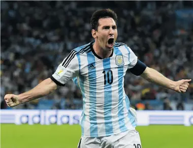  ?? MATTHIAS HANGST/Getty Images ?? Lionel Messi of Argentina celebrates after scoring his team’s second goal during the Group F match against Bosnia-Herzegovin­a at Maracana on Monday in Rio de Janeiro, Brazil. The goal proved critical when Bosnia-Herzegovin­a later scored.