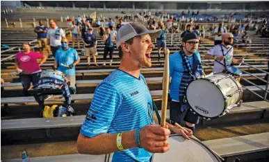  ?? STAFF PHOTO BY TROY STOLT ?? Andrew Bresee, part of the Chattahool­igans fan support group for Chattanoog­a Football Club, leads a chant during CFC’s match against Appalachia­n FC on Wednesday at Finley Stadium.