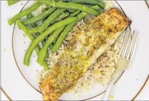  ?? AP PHOTO ?? Mustard and dill crusted salmon can be on the table in a hurry, making it a good choice for a busy weeknight.