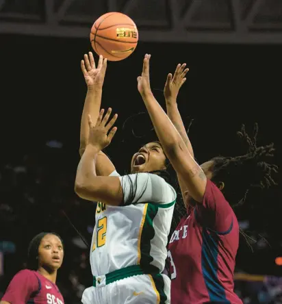  ?? KENDALL WARNER/STAFF ?? Norfolk State forward Kierra Wheeler puts up a shot against South Carolina State during an MEAC Tournament quarterfin­al Wednesday at Scope. Wheeler finished with 21 points and 10 rebounds.