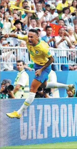  ?? CARLOS GARCIA RAWLINS / REUTERS ?? Neymar celebrates opening the scoring for Brazil in Monday’s 2-0 victory over Mexico at the World Cup in Russia. Brazil will face Belgium in the quarterfin­als on Friday.
