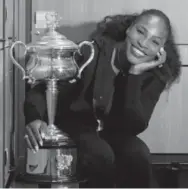  ?? FIONA HAMILTON/AFP/GETTY IMAGES ?? Serena Williams poses with the Aussie trophy for the seventh time, 14 years after the first.