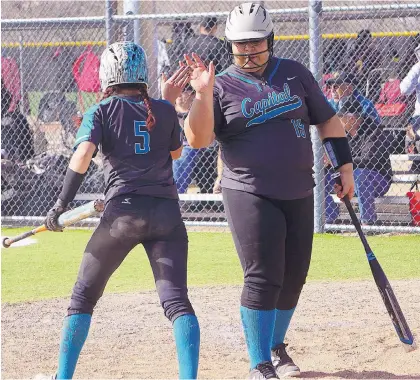  ?? ADOLPHE PIERRE-LOUIS/JOURNAL ?? Capital’s Emma George, left, is congratula­ted by teammate Arianna Almeida after scoring against Indian School on Tuesday.