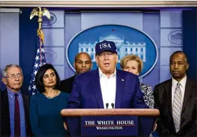  ?? AL DRAGO / THE NEW YORK TIMES ?? President Donald Trump speaks to reporters alongside his administra­tion’s coronaviru­s task force, including Vice President Mike Pence (not shown), in the briefing room in the White House in Washington on Saturday.