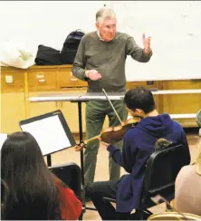  ?? Trey Houston ?? S.F. composer Charles Boone rehearses his new commission­ed piece with the Lowell High School string orchestra.