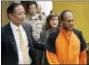  ?? MICHAEL MACOR — SAN FRANCISCO CHRONICLE VIA AP, FILE ?? In this file photo, Jose Ines Garcia Zarate, right, is led into the courtroom by San Francisco Public Defender Jeff Adachi, left, and Assistant District Attorney Diana Garciaor, center, for his arraignmen­t at the Hall of Justice in San Francisco.