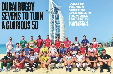  ?? Clint Egbert/Gulf News ?? Captains of the Emirates Airline Dubai Rugby Sevens teams with the trophies in front of the iconic Burj Al Arab yesterday.