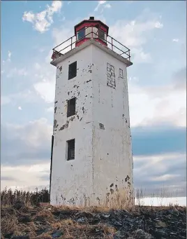 ?? SUBMITTED PHOTO ?? The Caribou Island lighthouse stands as a single structure now that a lower building has been removed. A community group is working with the federal government, coast guard and municipali­ty in hopes of taking over control of it so that it can be made...
