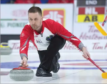  ?? Canadian Press photo ?? Newfoundla­nd and Labrador skip Brad Gushue delivers a rock against Alberta at the Tim Hortons Brier curling championsh­ip at Mile One Centre in St. John’s on Saturday.