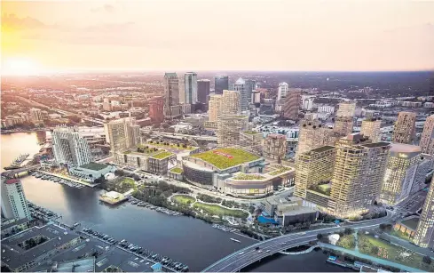  ?? STRATEGIC PROPERTIES/RIVERFILM VIA THE NEW YORK TIMES ?? An aerial rendering provided by the Water Street Tampa developers showing downtown Tampa’s waterfront along the Hillsborou­gh River with the finished $3 billion multiuse project in place.