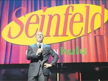  ?? Craig Barritt
Getty Images for Hulu ?? JERRY SEINFELD speaks at the Hulu upfront presentati­on in New York. The service’s deal to stream all 180 episodes of the sitcom cost an estimated $700,00 to $1 million per episode.